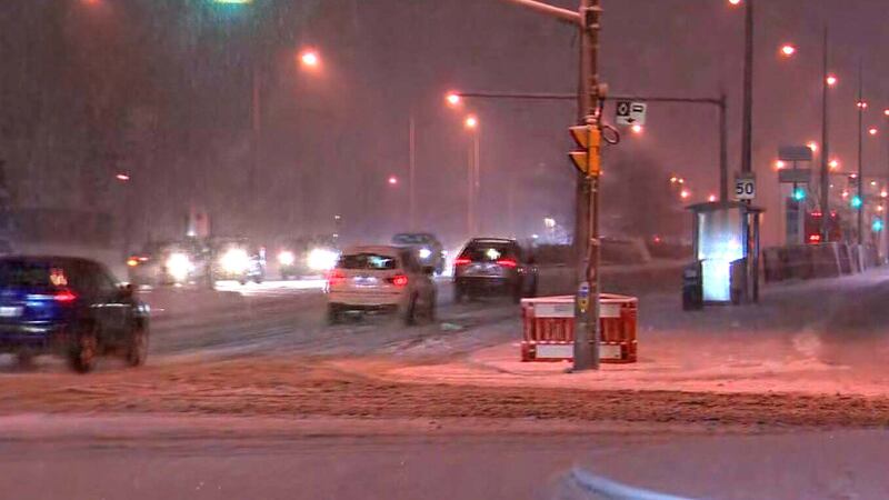 Snow falls in Toronto on Wednesday, Dec. 10, 2025.